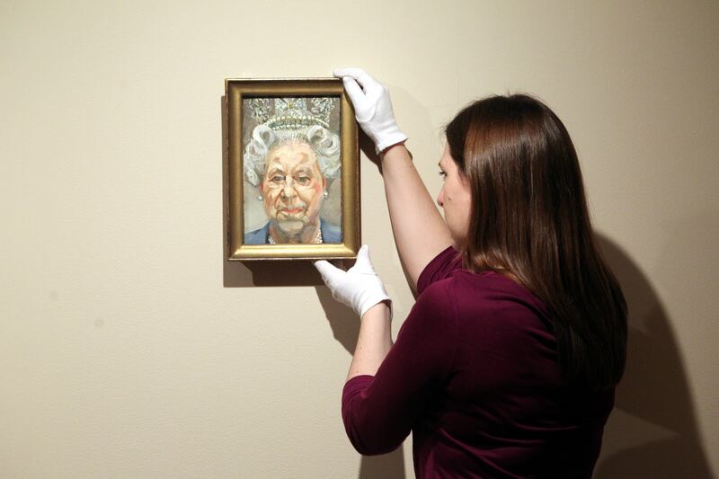 A portrait of Queen Elizabeth by Lucian Freud hangs during an exhibition at Windsor Castle in 2012. Getty Images