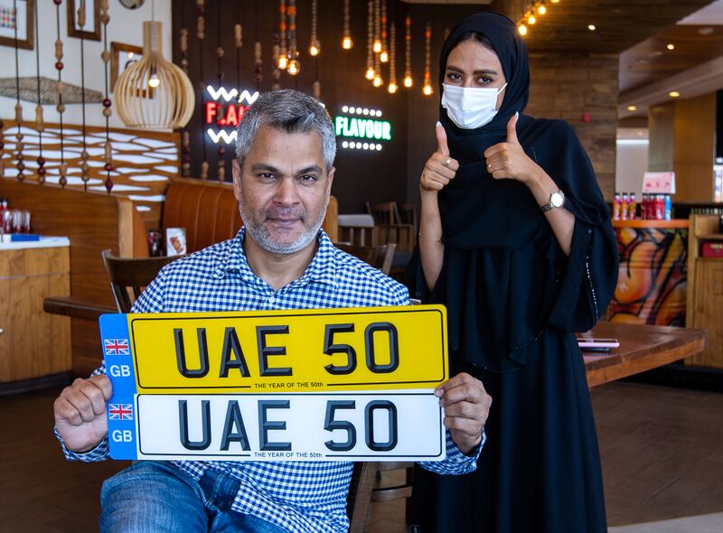 Mohammed Luqman Ali Khan, motoring historian, presents the UAE 50 number plate which has gone up for auction and is expected to break records as it coincides with the country’s 50th anniversary celebrations.