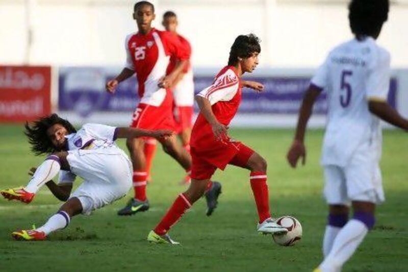 The UAE, in red, and Al Ain played out a 3-3 draw at Khalifa bin Zayed Stadium yesterday, before Al Ain won 6-5 in a penalty shootout.