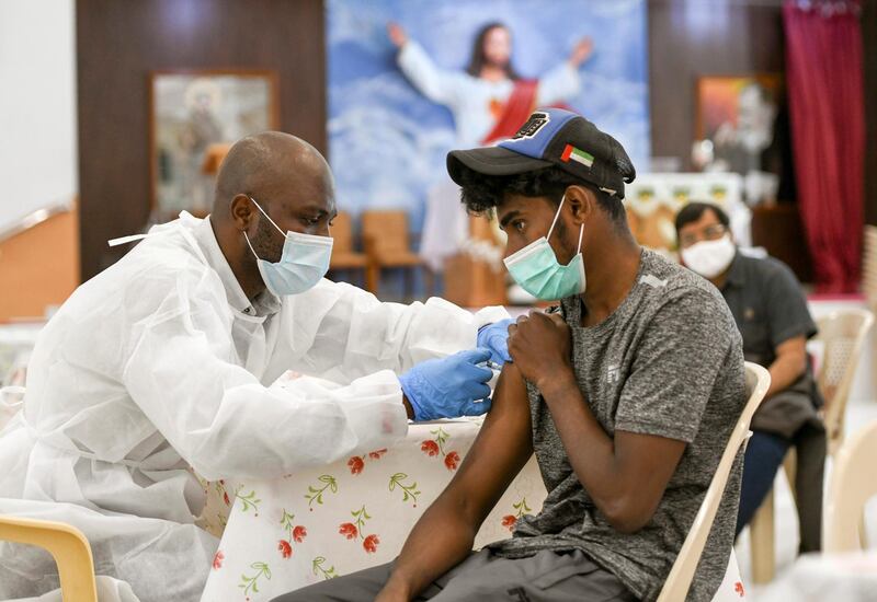 A man receives a dose of a vaccine against the coronavirus disease (COVID-19)at St. Paul's Church in Abu Dhabi, United Arab Emirates January 16, 2021. REUTERS/Khushnum Bhandari