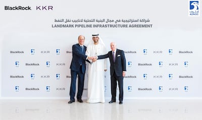 Dr Sultan Al Jaber with Larry Fink (L) and Henry Kravis (R) in Abu Dhabi on Sunday. Courtesy Adnoc