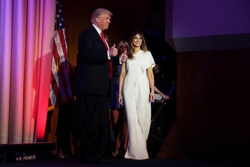 President elect Donald Trump with wife Melania on election night last November. Right, from top, Michael Cinco, Sophie Theallet, and Tom Ford. Chip Somodevilla / Getty Images