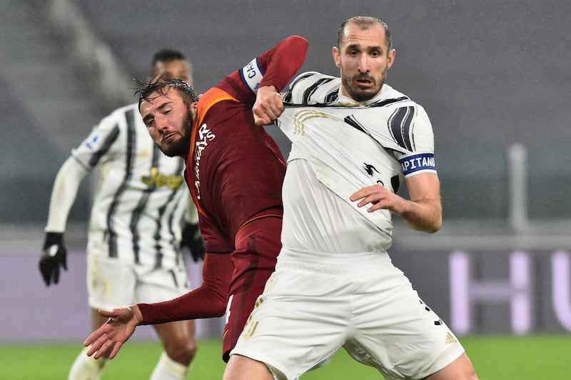 Juventus defender Giorgio Chiellini battlles with Roma's Bryan Cristante. Reuters