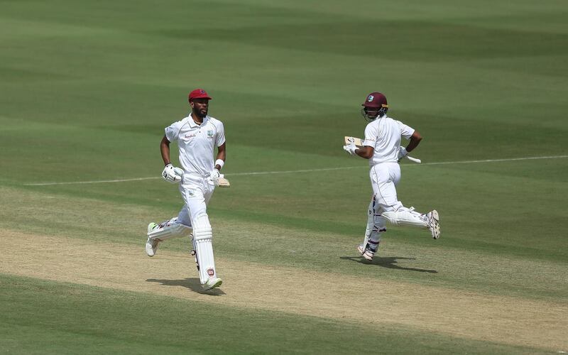 West Indies' cricketer Shane Dowrich, right, and Roston Chase run between the wickets during the first day of the second cricket test match between India and West Indies in Hyderabad, India.