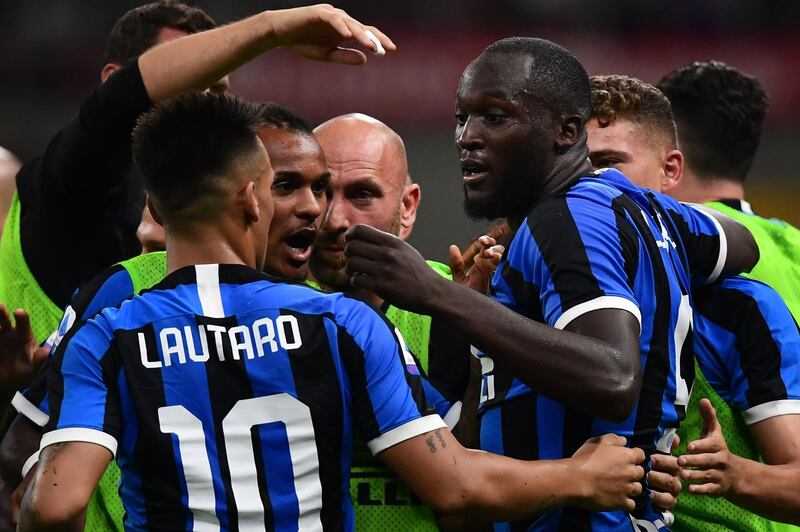 Inter Milan's Belgian forward Romelu Lukaku celebrates with fellow forward Lautaro Martinez. AFP