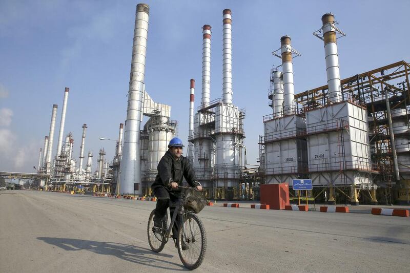 The oil sanctions on Iran will not be lifted until the end of the year, only after the International Atomic Energy Agency issues a report in mid-December. Vahid Salemi / AP Photo