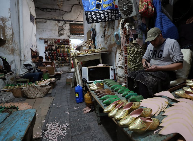 The workshop manufactures 120 shoes a day