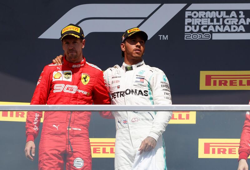 Lewis Hamilton, right, pulled Vettel up on the podium with him post-race. EPA