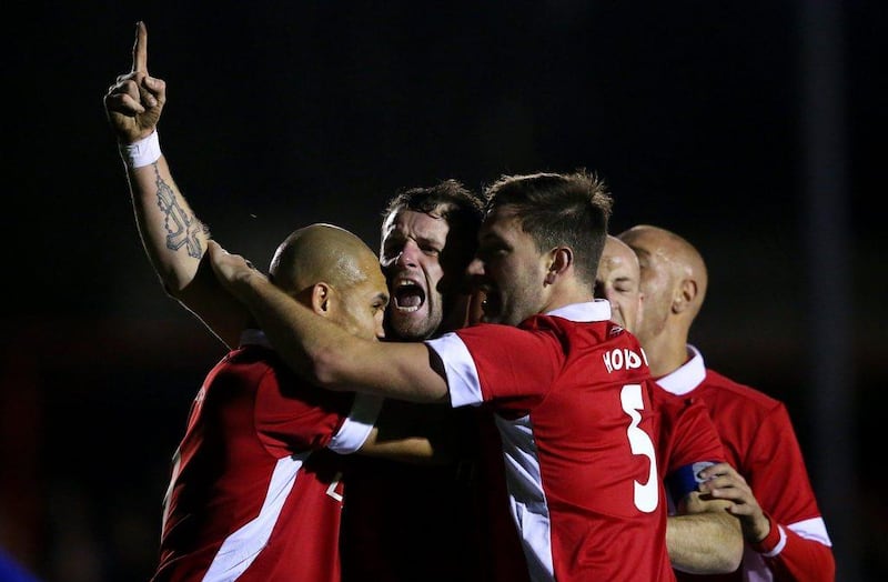 Stephen O'Halloran, centre, of Salford City celebrates with his teammates after scoring in his team's FA Cup second round 1-1 draw against Hartlepool on Friday night. Alex Livesey / Getty Images / December 4, 2015