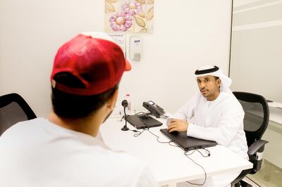 Sami Hassan, of the Erada Centre, counsels a young addict sent for rehab. Reem Mohammed / The National