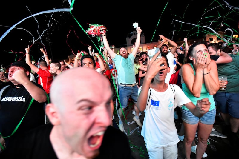 Hungary fans celebrate as they watch the match in Budapest. Reuters