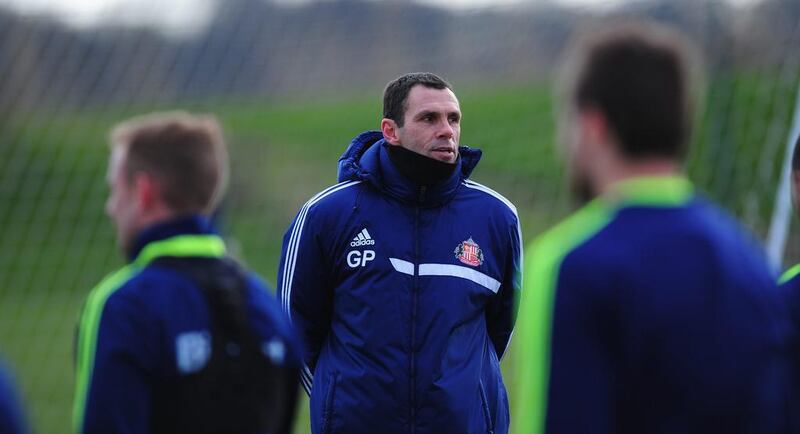 Sunderland manager Gus Poyet looks on during training on February 26, 2014, ahead of the Capital One Cup final against Manchester City. Stu Forster / Getty Images