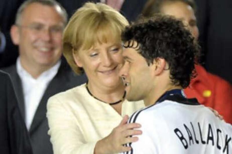Angela Merkel, the German Chancellor, comforts Michael Ballack after Germany lost the Euro 2008 final in Vienna.