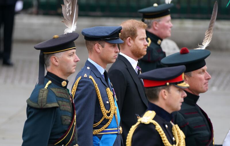 Prince William and Prince Harry make their way to Westminster Abbey. PA