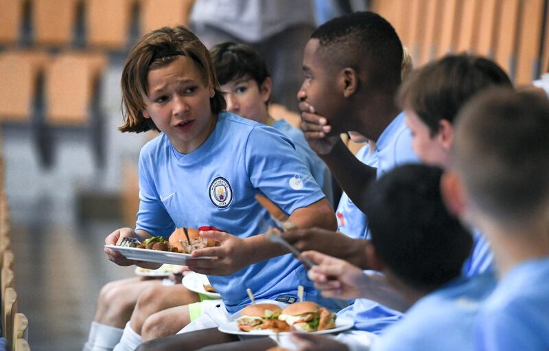 Abu Dhabi, United Arab Emirates - Game screening of Manchester City vs. Brighton Albion football match along with an Iftar buffet at Mubadala Arena, Zayed Sports City. Khushnum Bhandari for The National
