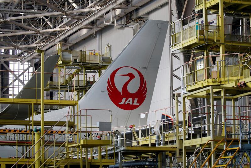 FILE PHOTO: The logo of Japan Airlines (JAL) is seen on the tail fin of the company's airplane, at a Haneda Airport hangar in Tokyo, Japan April 3, 2017. REUTERS/Toru Hanai/File Photo