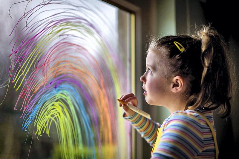 Self isolation during the Covid-19 coronavirus pandemic, Edinburgh, March 28th 2020. My daughter draws a rainbow on our window so passing children can see by Helen Patience


