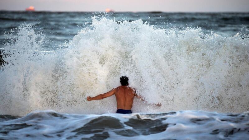 Body surfer Andrew Vanotteren crashes into waves from Hurricane Florence on the south beach of Tybee Island, Georgia. AP Photo