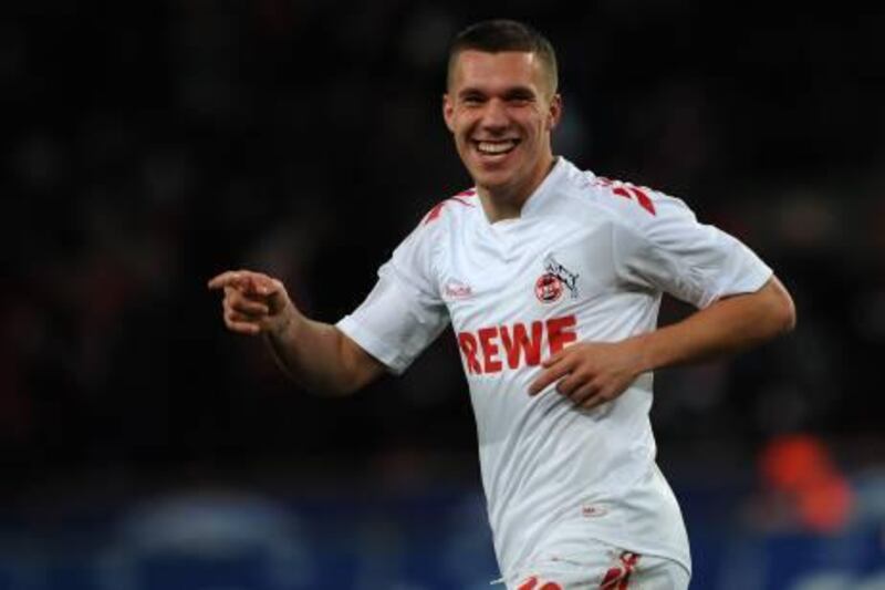 Cologne's striker Lukas Podolski celebrates during the German first division Bundesliga football match 1. FC Cologne vs 1.FSV Mainz 05 in the western German city of Cologne, on December 13, 2011.  AFP PHOTO / PATRIK STOLLARZ

RESTRICTIONS / EMBARGO - DFL LIMITS THE USE OF IMAGES ON THE INTERNET TO 15 PICTURES (NO VIDEO-LIKE SEQUENCES) DURING THE MATCH AND PROHIBITS MOBILE (MMS) USE DURING AND FOR FURTHER TWO HOURS AFTER THE MATCH. FOR MORE INFORMATION CONTACT DFL.