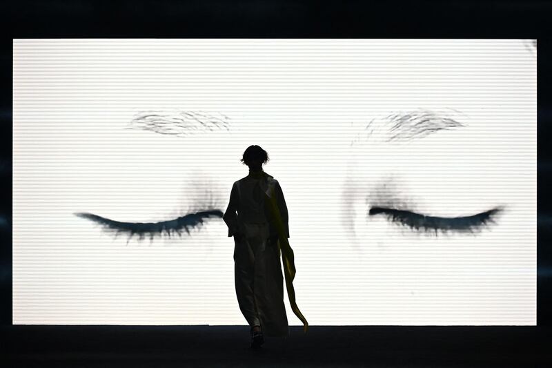 A model presents a creation from Spanish designer Ulises Merida's autumn-winter 2021 / 2022 collection during Mercedes Benz Fashion Week in Madrid. AFP