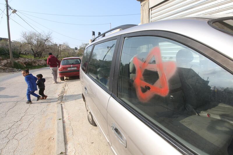 epa07368518 The Star of David was sprayed on a car by suspected Jewish settlers in the Skaka village near the West Bank city of Salfit, 14 February 2019. Residents from the village said at least 22 cars had their tires slashed by suspected Israeli settlers after they allegedly raided the village, spraying graffities on walls and on the main mosque.  EPA/ALAA BADARNEH