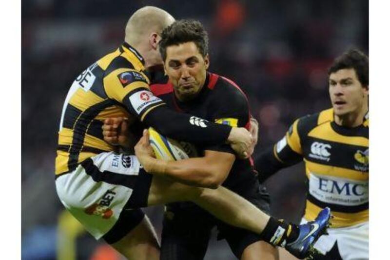 Gavin Henson, right, is tackled near the try line by Wasps’ Joe Simpson yesterday.