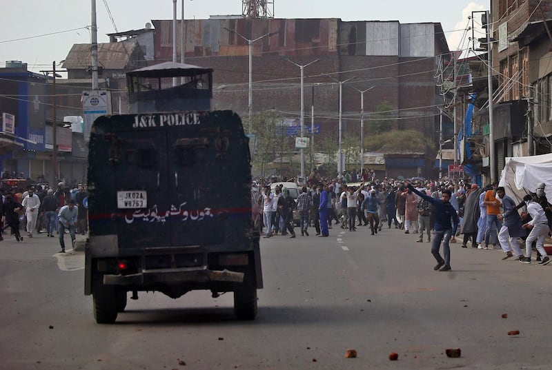 Kashmiri demonstrators throw pieces of bricks and stones towards an Indian police vehicle during a protest after Jumat-ul-Vida or the last Friday prayers of the holy fasting month of Ramadan, in Srinagar May 31, 2019. REUTERS/Danish Ismail