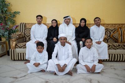 Juma Mubarak Al Ali, in the centre of the front row, with his family. Leslie Pableo for The National