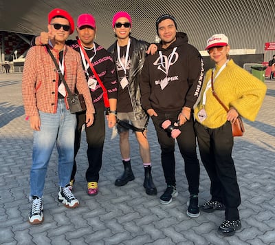 Ivan Cabatit, left, and Jeff Quinto, fourth from left, with friends at the Blackpink concert. Evelyn Lau / The National
