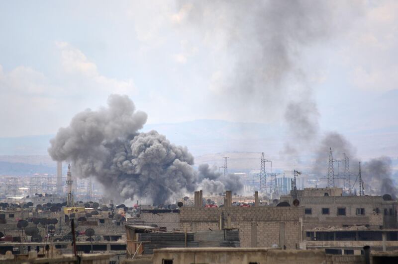 Smoke billowing from the Palestinian camp of Yarmouk, south of the Syrian capital Damascus. Rami al Sayed / AFP