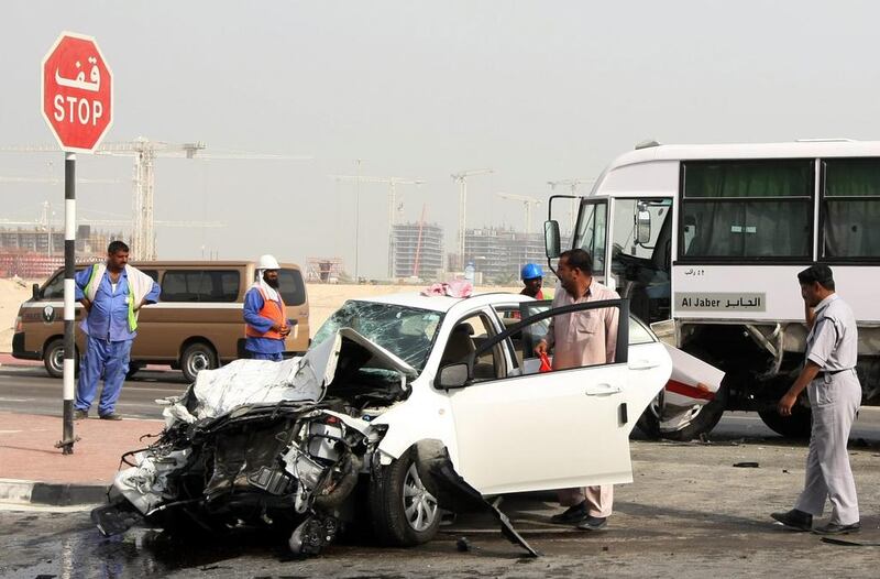 Police at a car accident in Abu Dhabi. Andrew Parsons / The National