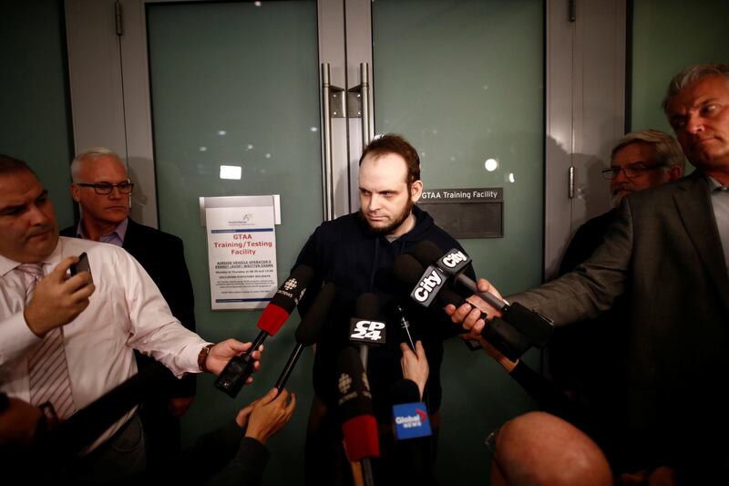 Joshua Boyle speaks to the media after arriving with his wife and three children to Toronto Pearson International Airport, nearly 5 years after he and his wife were abducted in Afghanistan in 2012 by the Taliban-allied Haqqani network, in Toronto, Ontario, Canada, October 13, 2017.    REUTERS/Mark Blinch