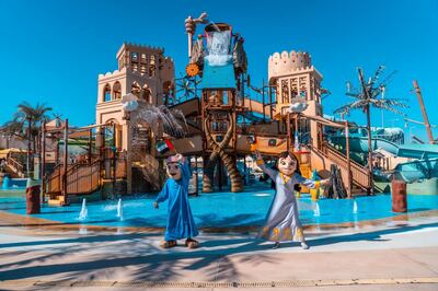 Characters dressed in traditional clothes at Yas Waterworld. 