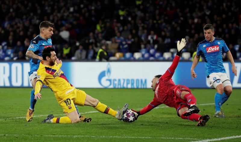 Barcelona's Lionel Messi in action with Napoli's David Ospina as he misses a chance to score. Reuters