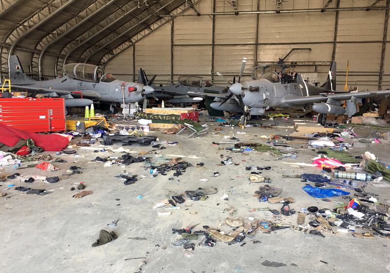 Damaged Afghan military aircraft are parked in a hangar after the Taliban's takeover of Hamid Karzai International Airport in Kabul. AP
