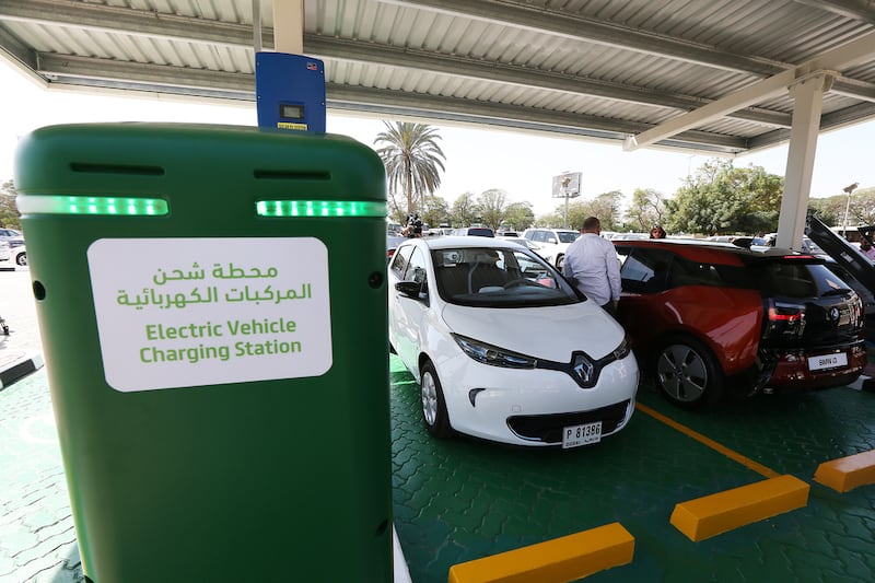 Electric cars on display during the launch of a car charging station at the Dewa headquarters in Garhoud, Dubai. Pawan Singh / The National