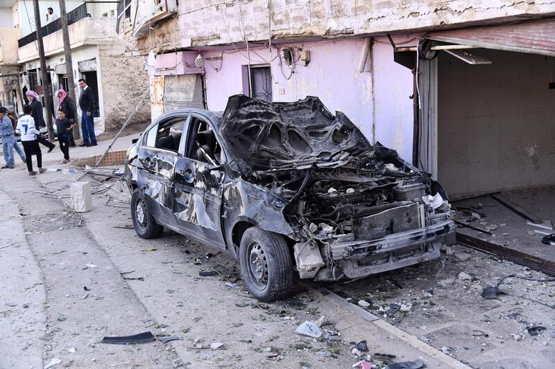A handout picture released by the official Syrian Arab News Agency (SANA) on November 20, 2019 shows the wreckage of a car at the scene of a reportedly Israeli air strike in the Syrian village of Beit Saber, southwest of the capital Damascus. - The Israeli army confirmed that it carried out strikes against military sites in Damascus, in response to rocket fire from Syria the previous day. "We just carried out wide-scale strikes of Iranian Quds Force & Syrian Armed Forces targets in Syria in response to the rockets fired at Israel by an Iranian force in Syria," the Israel Defense Forces tweeted. Syria's state media earlier said Syrian anti-aircraft defences intercepted a "heavy attack" by Israeli warplanes over the capital Damascus. (Photo by - / SANA / AFP)