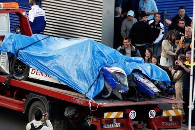 Anthony Davidson's car is returned to the pits after a mid-air flip at Le Mans