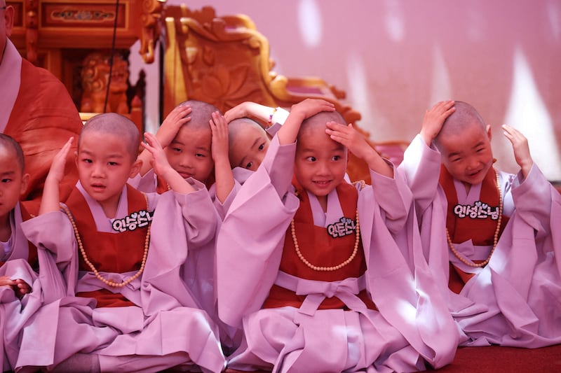 Novice monks with newly shaved heads at an event to celebrate the imminent Vesak Day, birthday of Buddha, at Jogye temple in Seoul, South Korea. Reuters