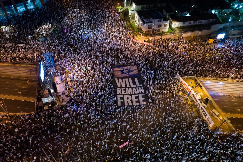 Tens of thousands of Israelis protest against plans by Prime Minister Benjamin Netanyahu's government to overhaul the judicial system in Tel Aviv on April 15, 2023.  AP