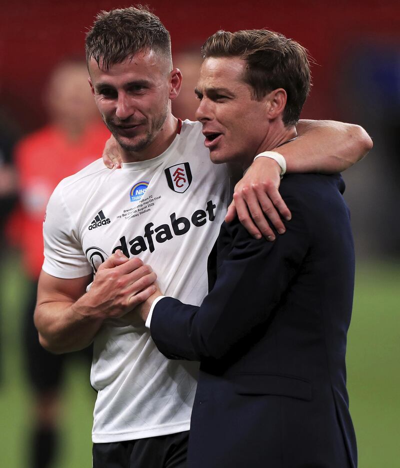 Fulham manager Scott Parker celebrates with goalscorer Joe Bryan. PA