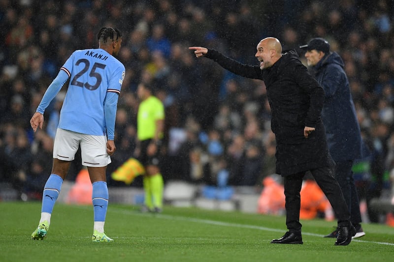 Manchester City manager Pep Guardiola talks to Manuel Akanji. AFP