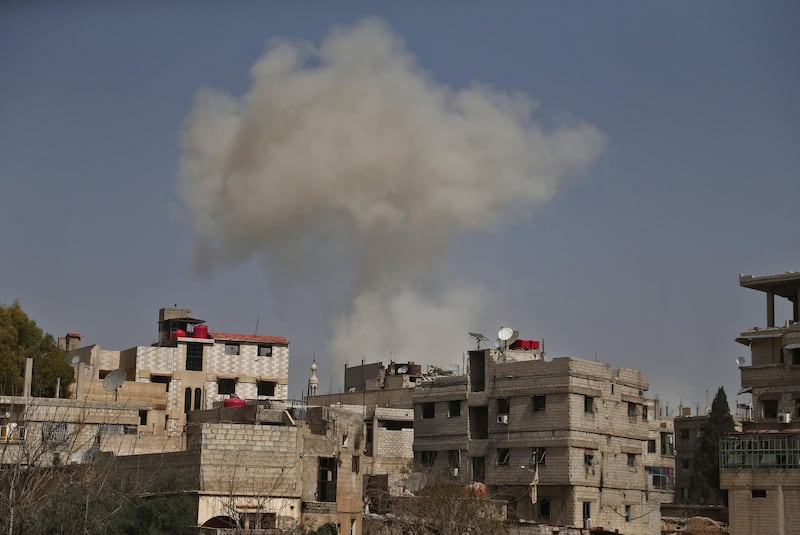 Smoke billows during Syrian government shelling on rebel-held areas in the Eastern Ghouta region on the outskirts of the capital Damascus on March 6, 2018. Abdulmonam Eassa / AFP