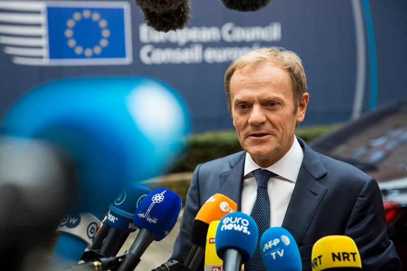 Mr Tusk addresses assembled media as he arrives at the Council of the European Union in 2016 in Brussels. Getty Images