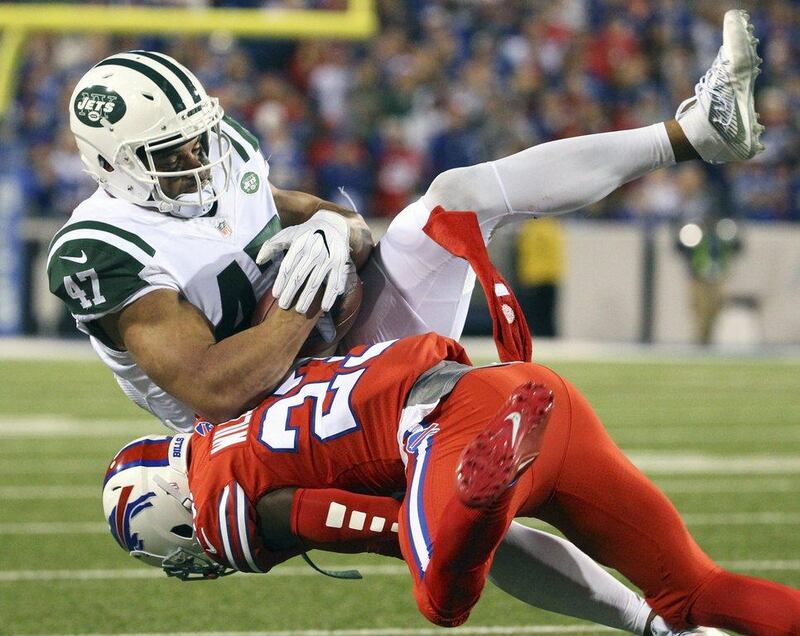New York Jets 37 Buffalo Bills 31: Jets tight end Kellen Davis is tackled by Bills strong safety Aaron Williams. Bill Wippert / AP Photo