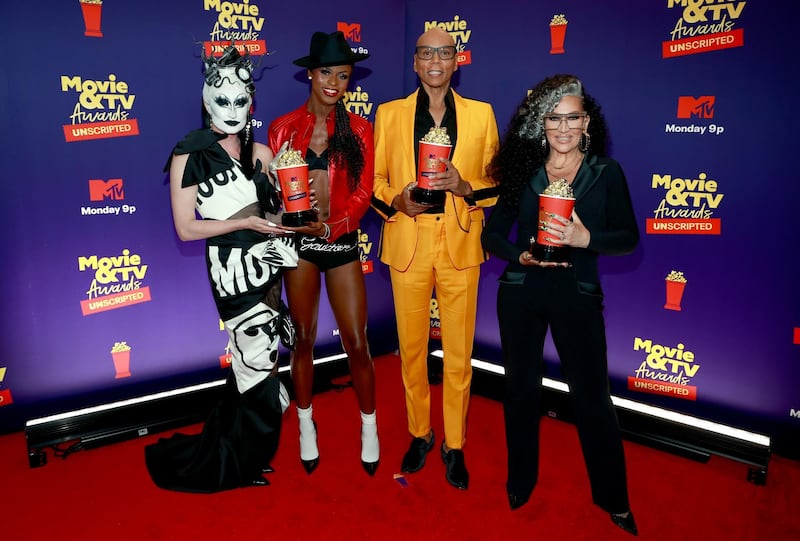 LOS ANGELES, CALIFORNIA - MAY 17: In this image released on May 17, (L-R) Gottmik, Symone, RuPaul, and Michelle Visage, winners of Best Reality Cast for "RuPaul's Drag Race", pose backstage during the 2021 MTV Movie & TV Awards: UNSCRIPTED in Los Angeles, California. (Photo by Matt Winkelmeyer/2021 MTV Movie and TV Awards/Getty Images for MTV/ViacomCBS)