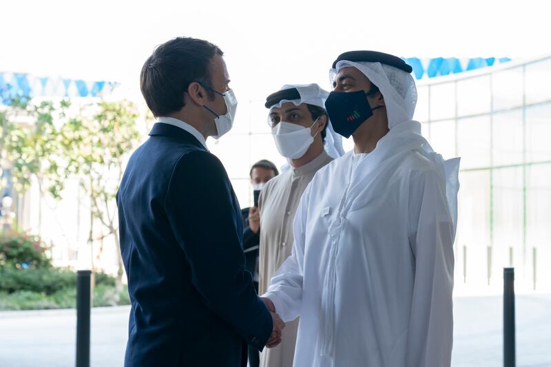 Sheikh Abdullah bin Zayed, Minister of Foreign Affairs and International Co-operation,  greets Mr Macron. Photo: Ministry of Presidential Affairs
