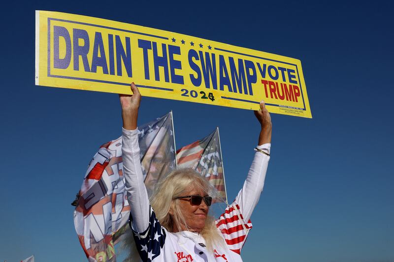 A supporter of Mr Trump near his Mar-a-Lago home in Palm Beach. Getty 