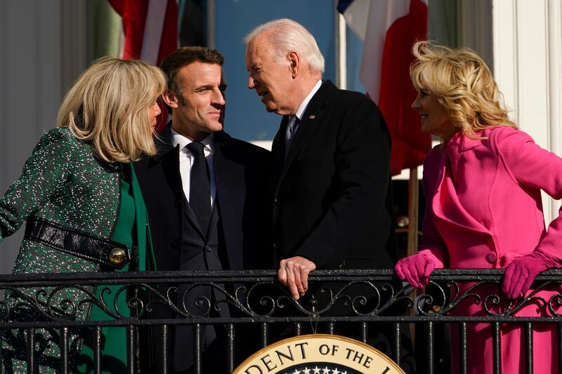 President Joe Biden and first lady Jill Biden with French President Emmanuel Macron and his wife Brigitte Macron talk on the Blue Room Balcony during a State Arrival Ceremony on the South Lawn of the White House in Washington. AP