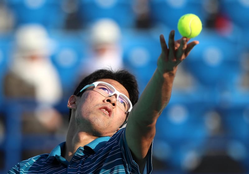 Abu Dhabi, United Arab Emirates - Reporter: Jon Turner: Hyeon Chung serves during the fifth place play-off between Andrey Rublev v Hyeon Chung at the Mubadala World Tennis Championship. Friday, December 20th, 2019. Zayed Sports City, Abu Dhabi. Chris Whiteoak / The National